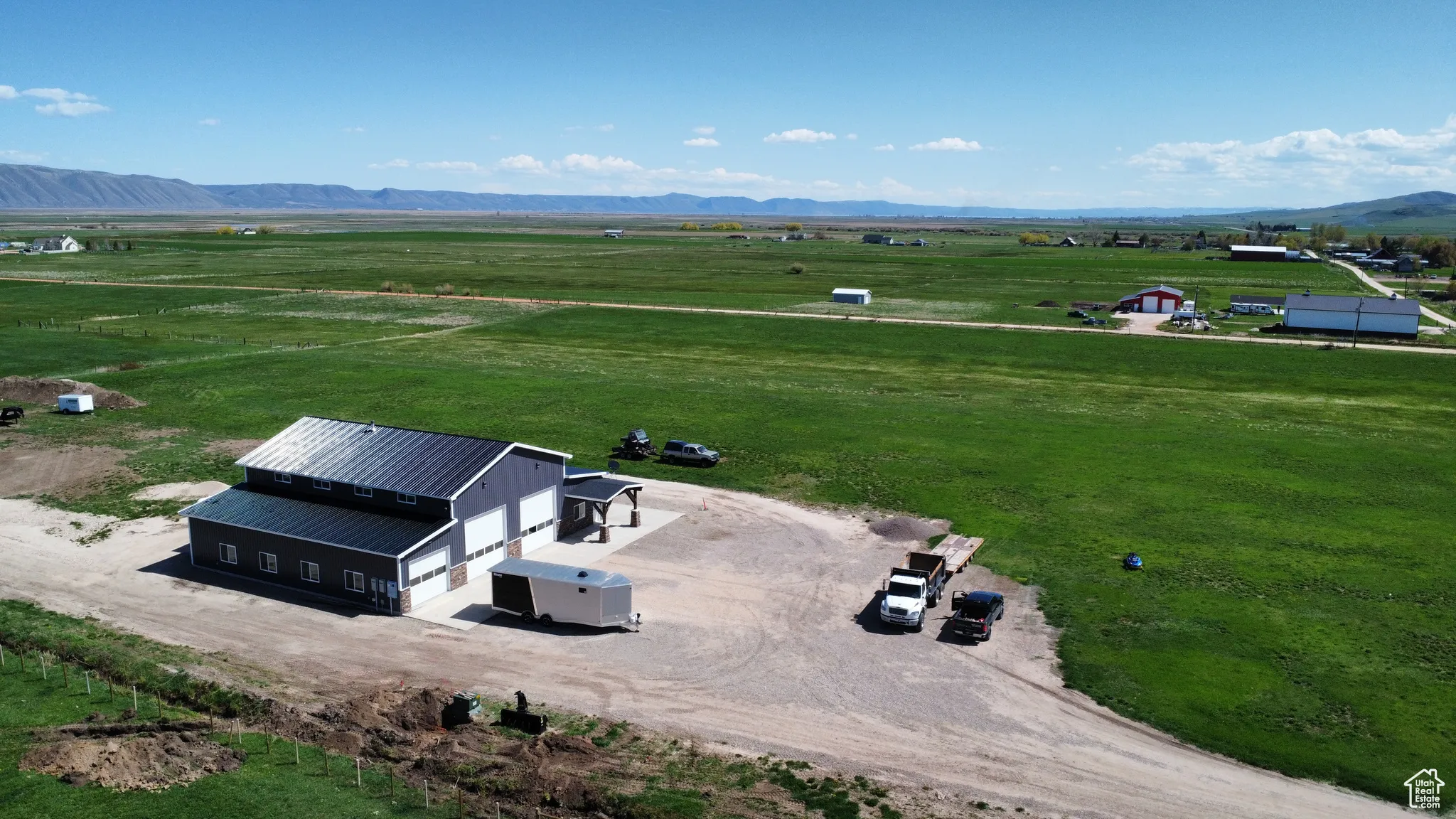 Aerial view of sparsely populated area with a mountainous background