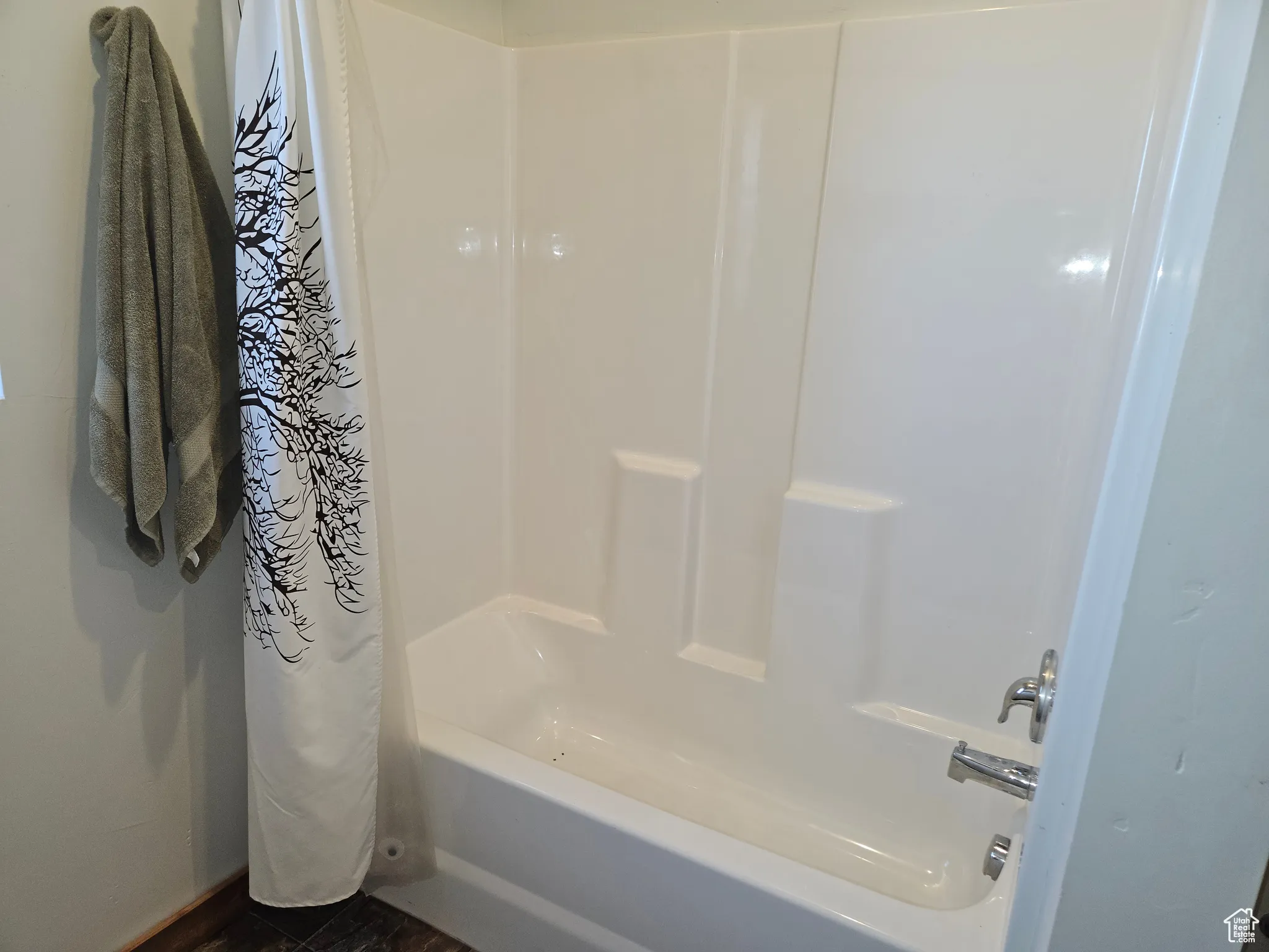 Full bath featuring shower / tub combo with curtain