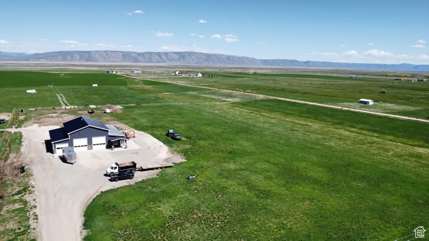 Aerial view of sparsely populated area featuring a mountain backdrop