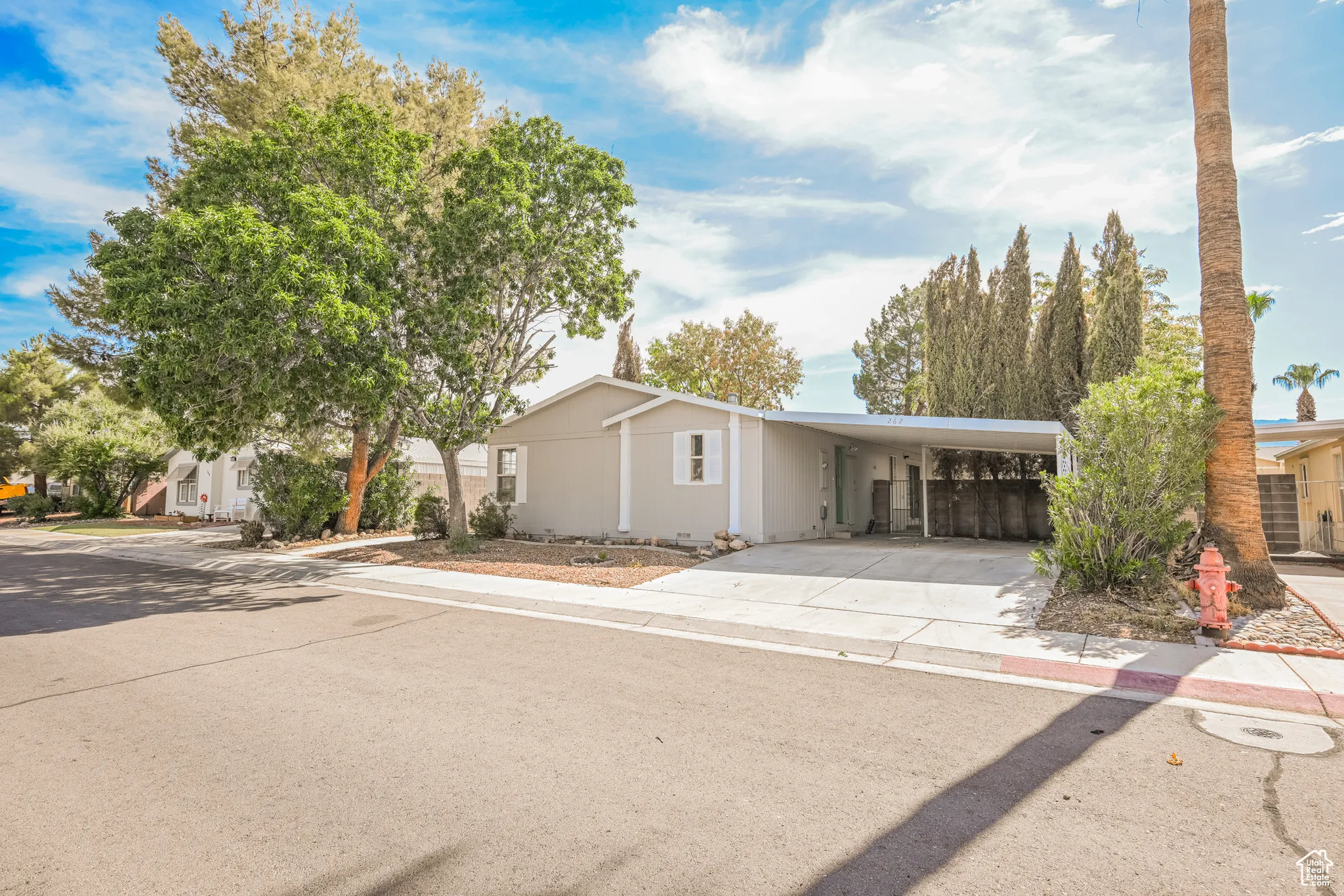 View of front of property featuring a carport