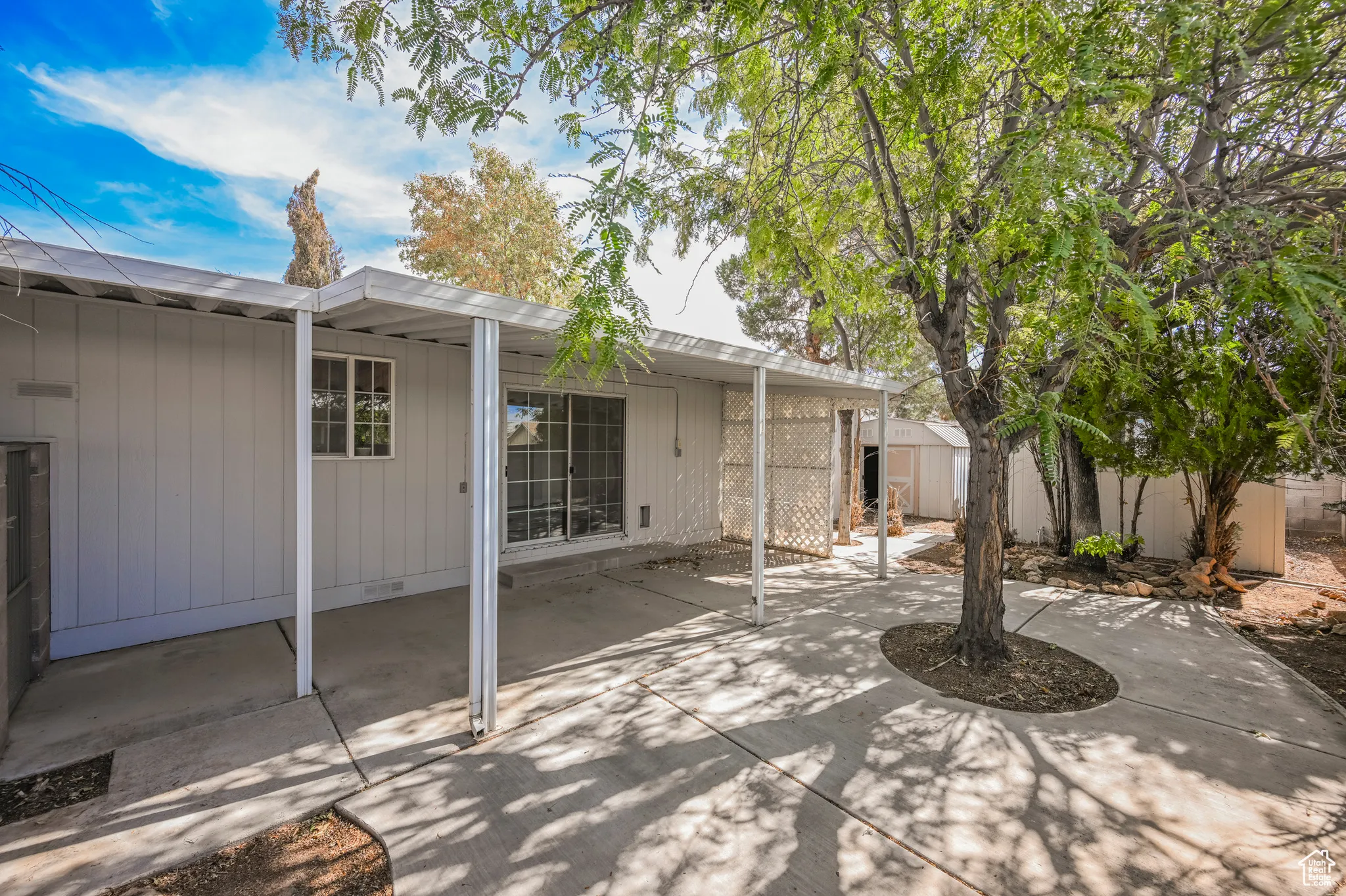 View of patio / terrace featuring a storage shed