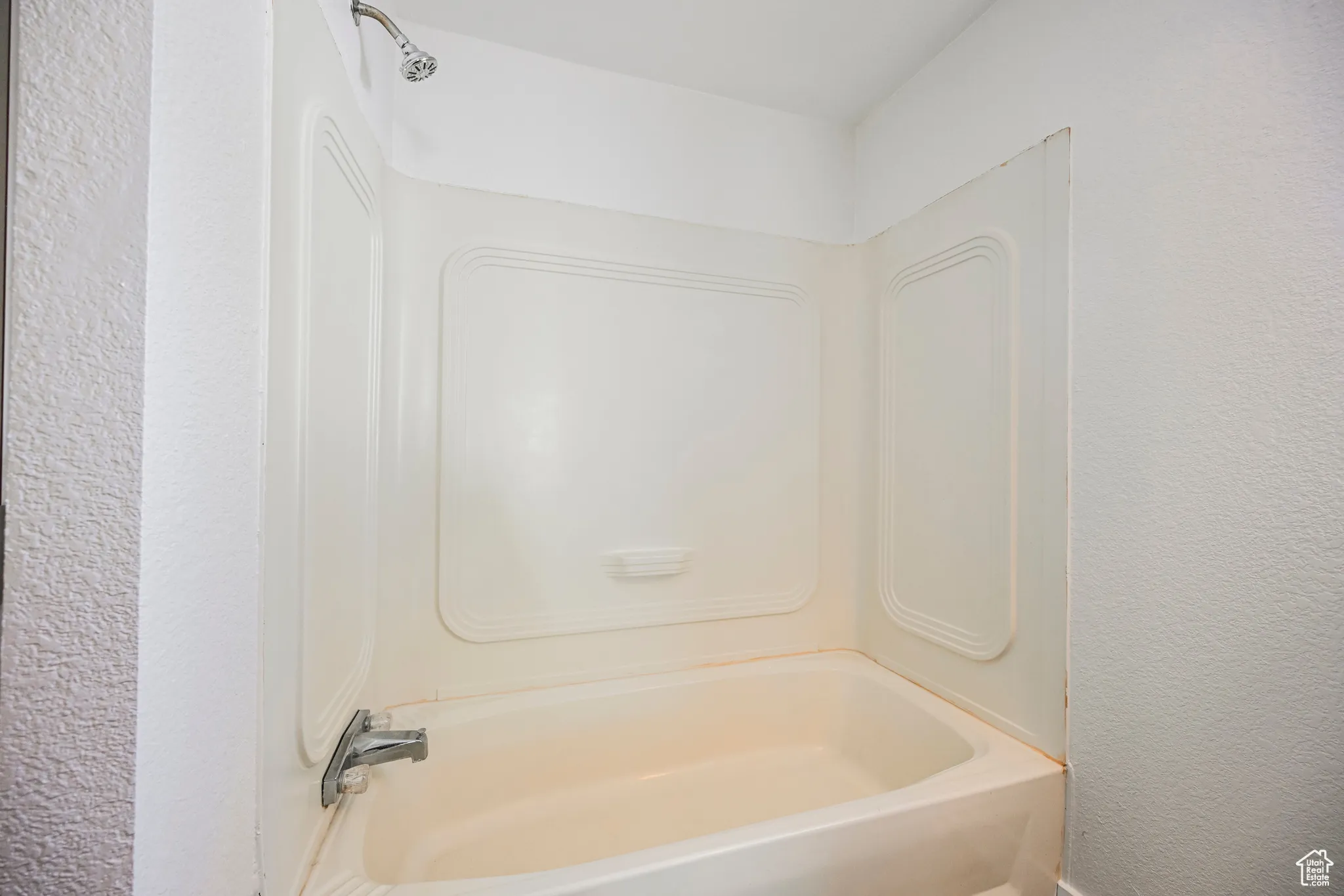 Bathroom with shower / bathing tub combination