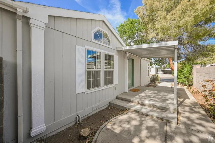 View of property exterior featuring a patio