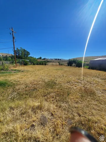 Back yard with field and mountain views