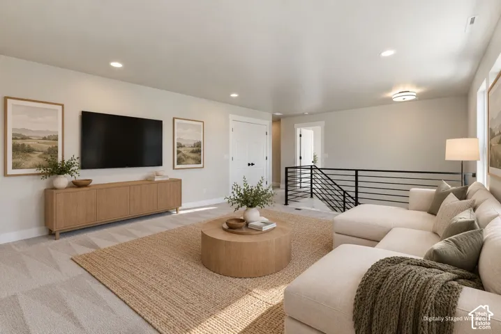 Open concept living area featuring a neutral color palette