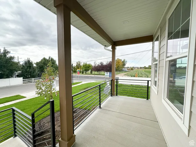 Covered porch with a yard