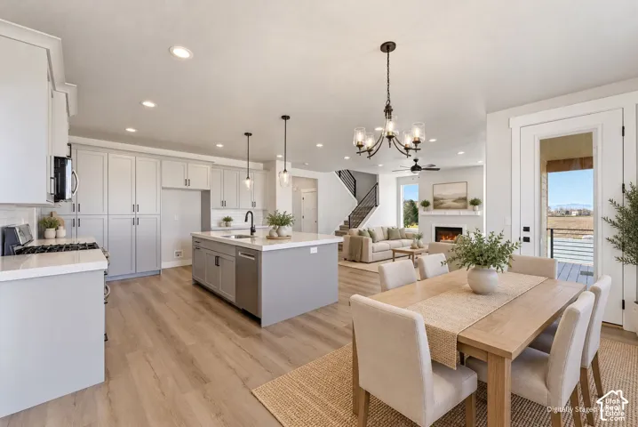 Open concept living area featuring wood-finish flooring