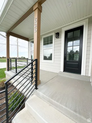 Property entrance featuring a porch