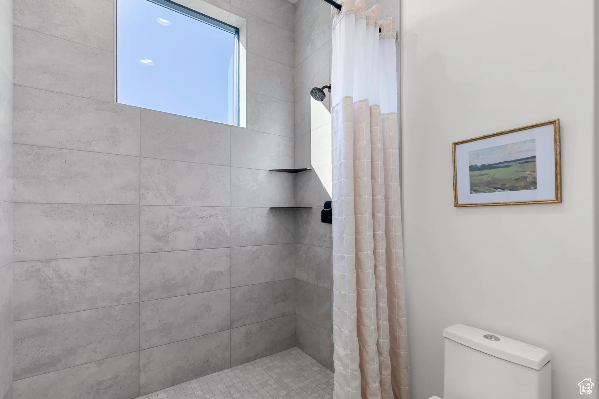 Full bathroom with a shower stall