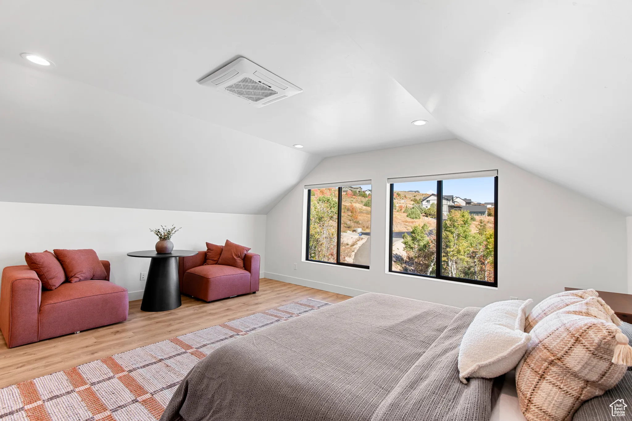 Bedroom featuring cooling unit, lofted ceiling, light wood-type flooring, and recessed lighting