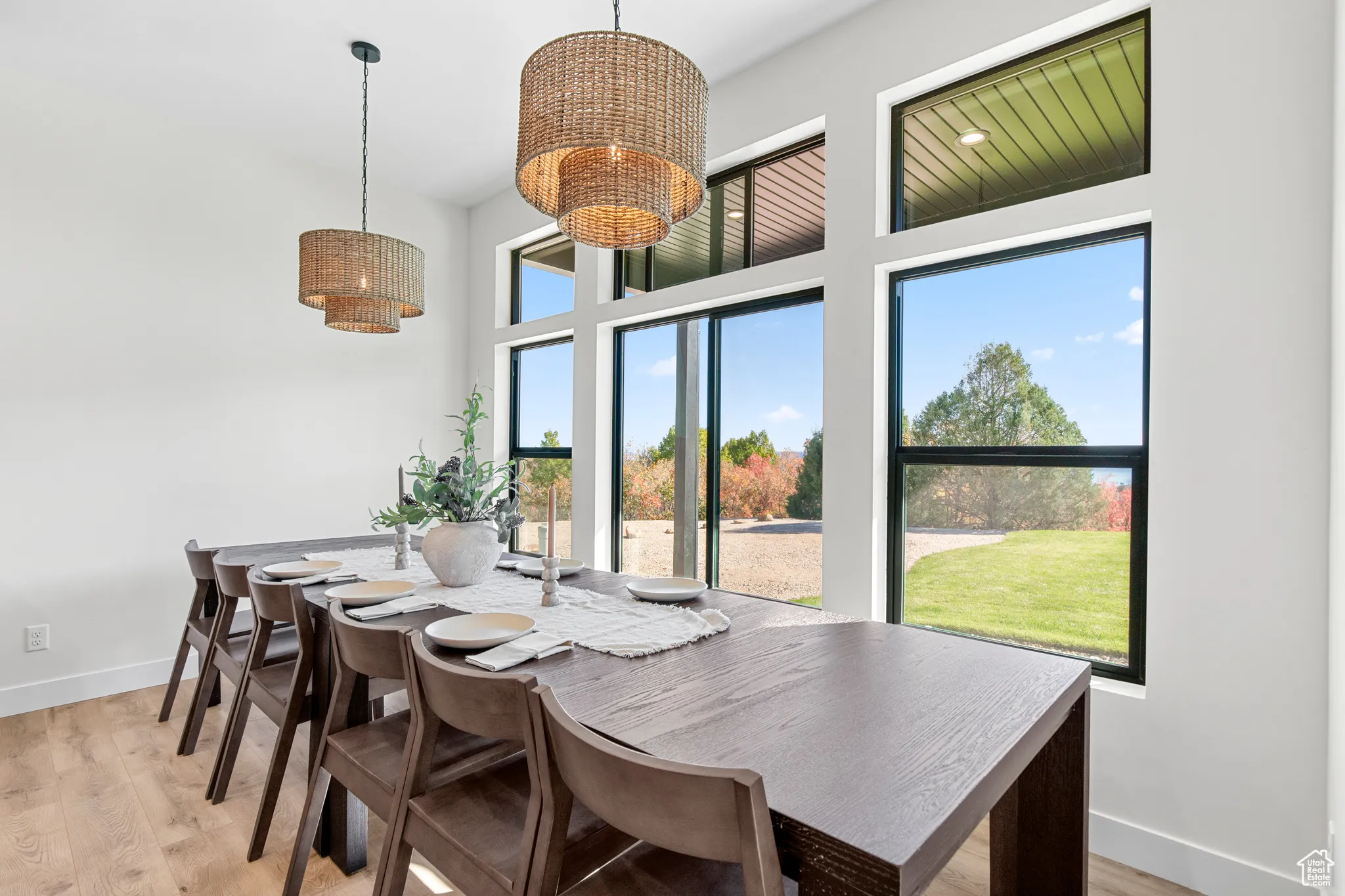 Dining area with a chandelier and light wood-type flooring