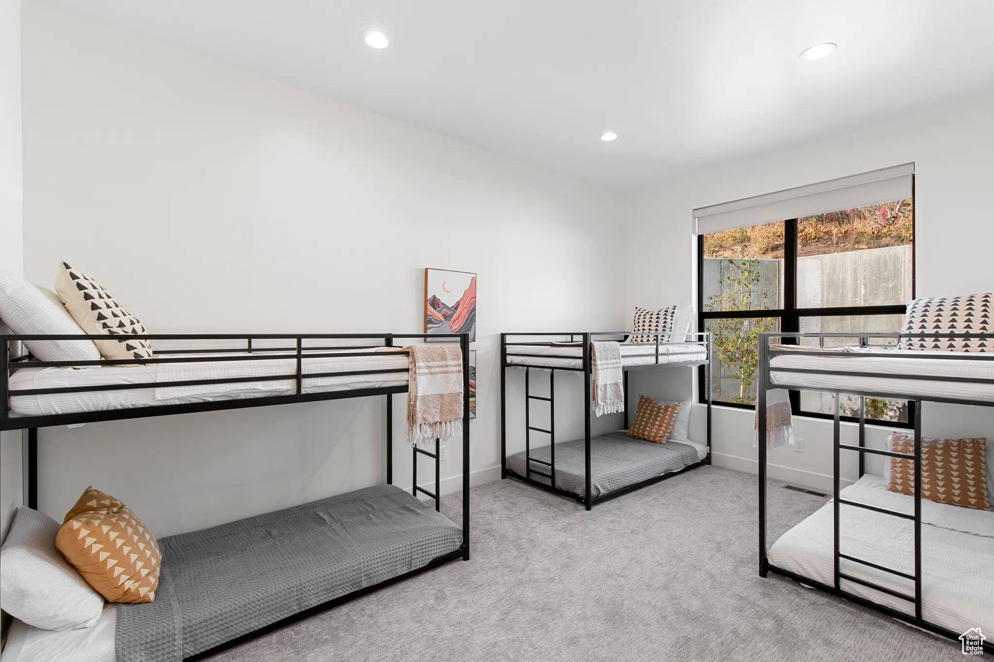 Bedroom featuring light colored carpet and recessed lighting