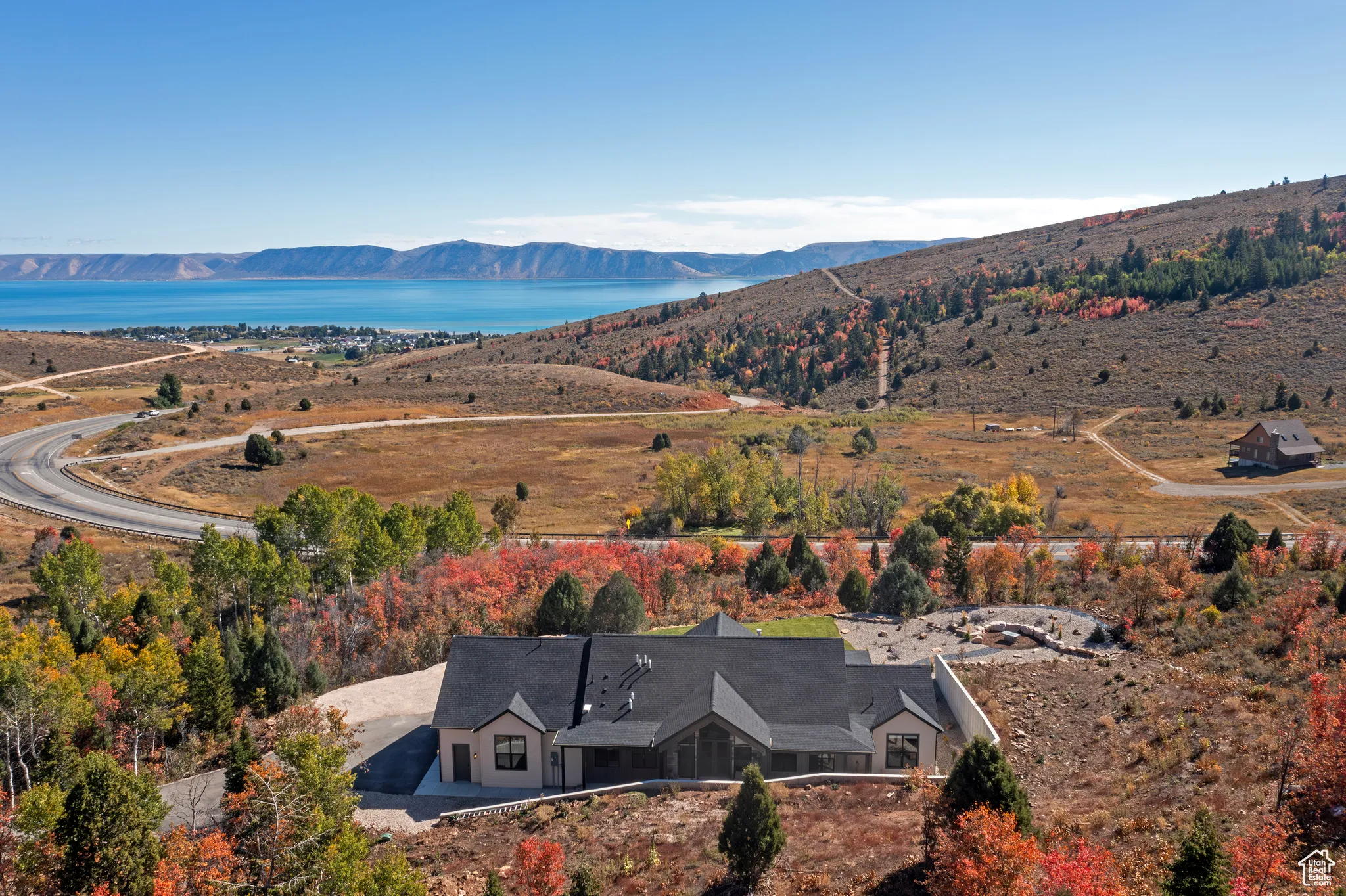 View from above of property with a water and mountain view