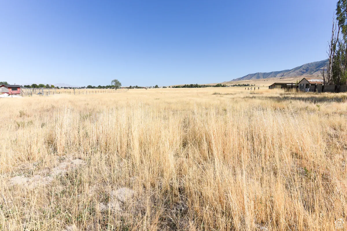 Property view of mountains with a rural view