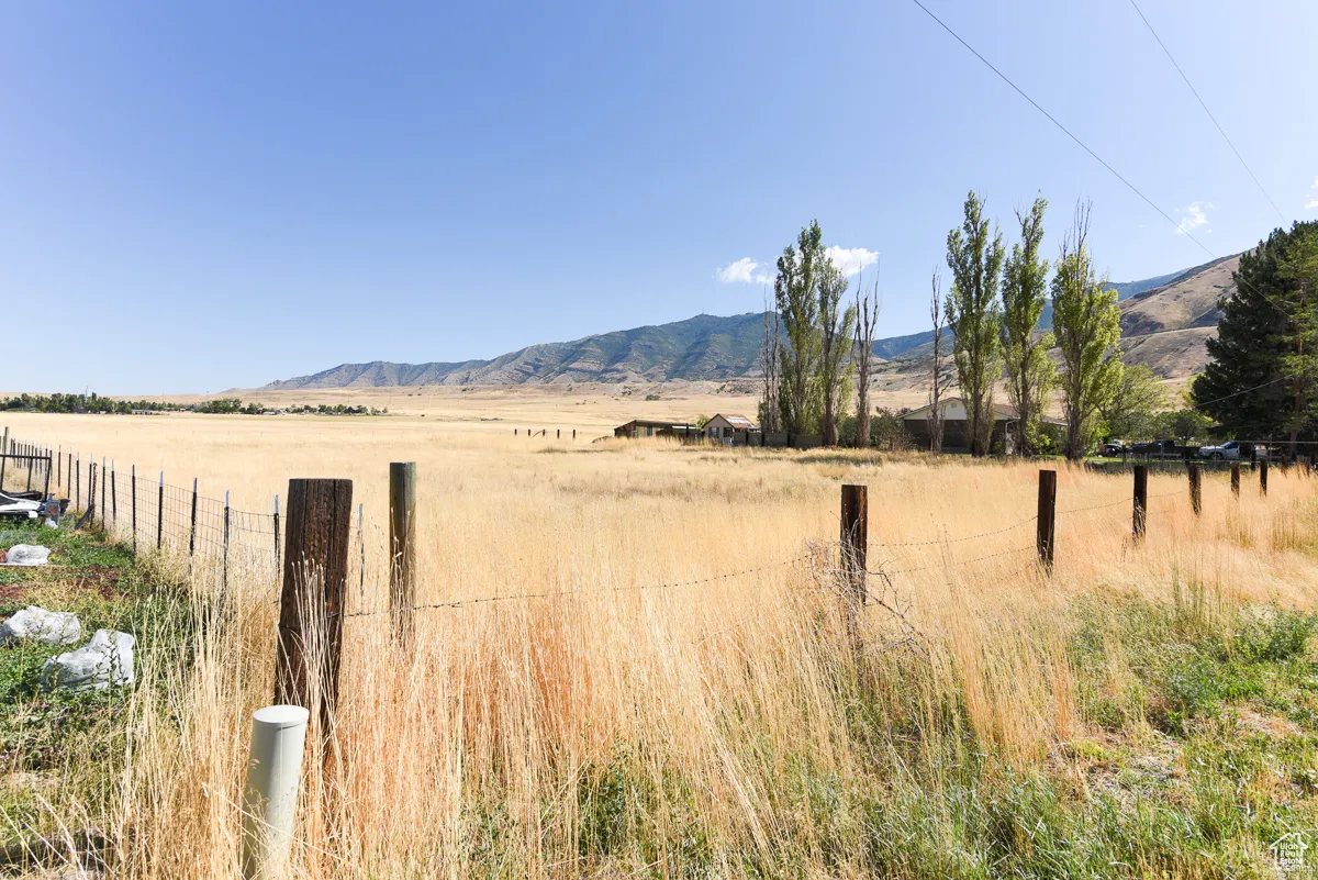 Property view of mountains featuring a rural view