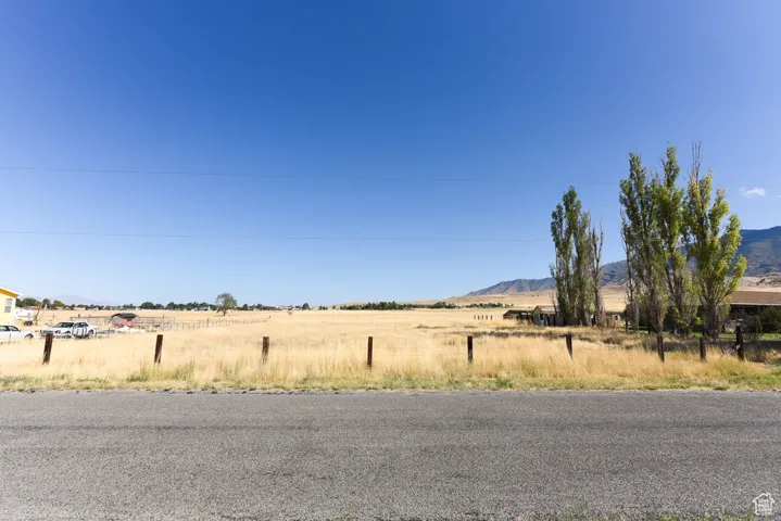 View of road with a rural view and a mountain view