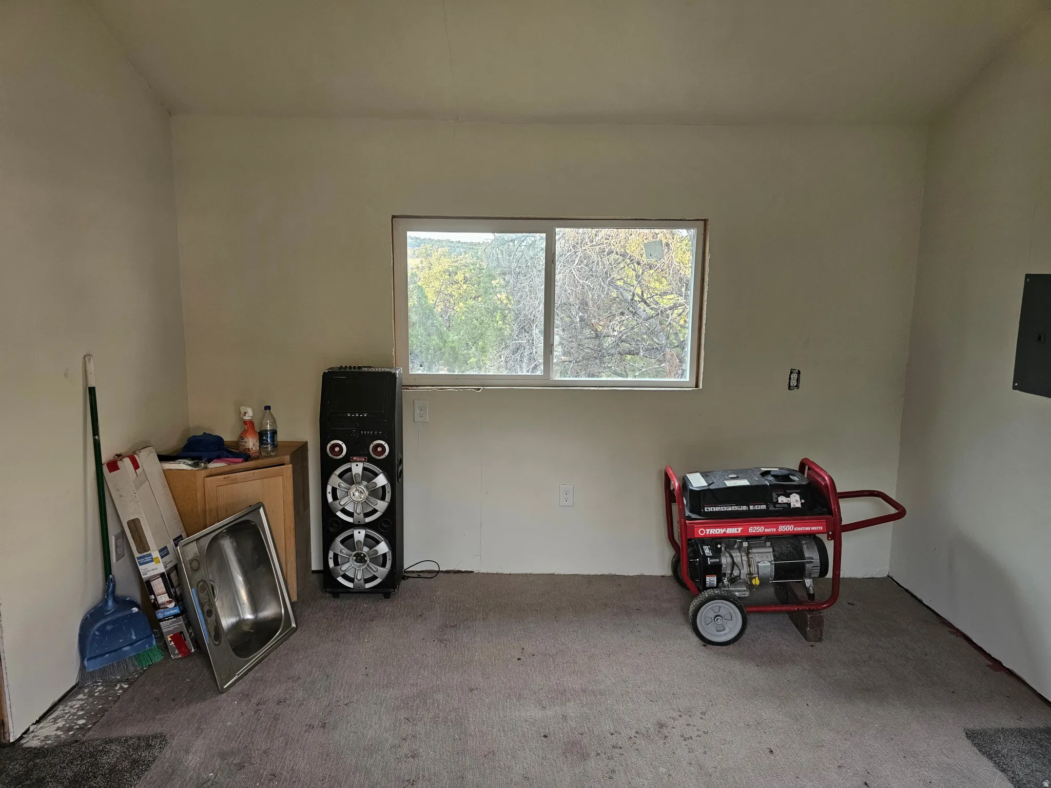 Garage featuring electric panel