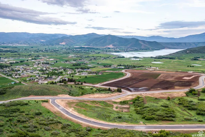 Aerial view featuring a water and mountain view
