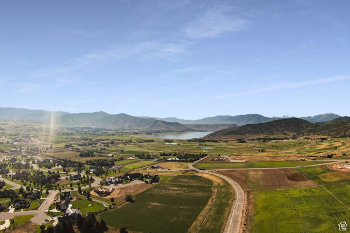 Property view of mountains with a water view