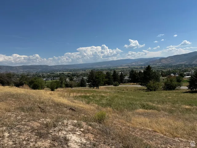 Property view of mountains with a rural view