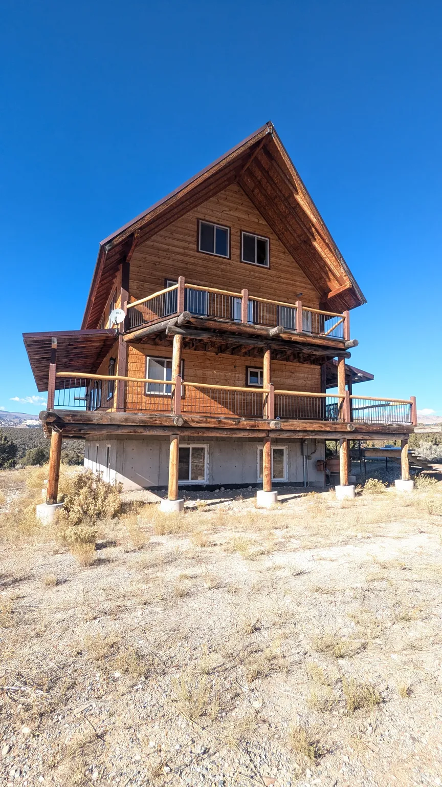 Rear view of house with a wooden deck