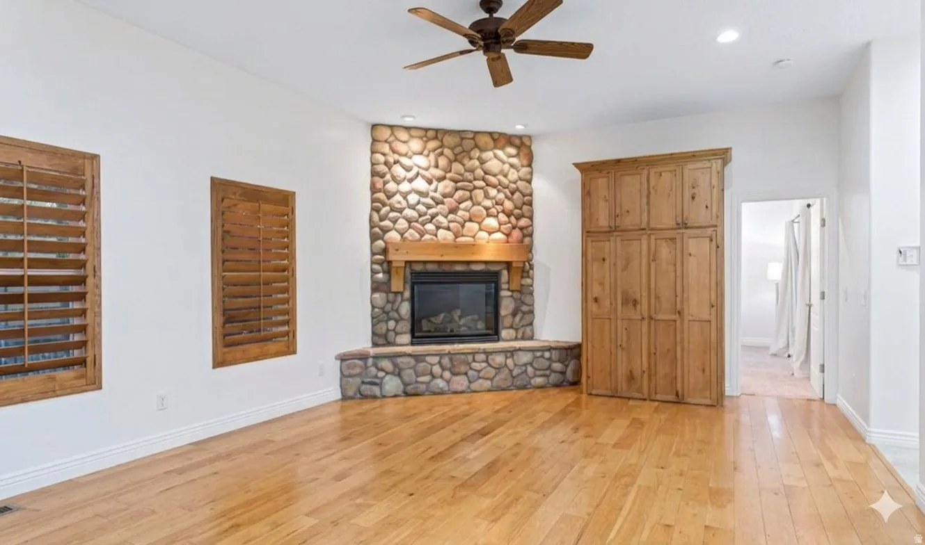Floor-to-ceiling stacked stone anchoring the main living space.
