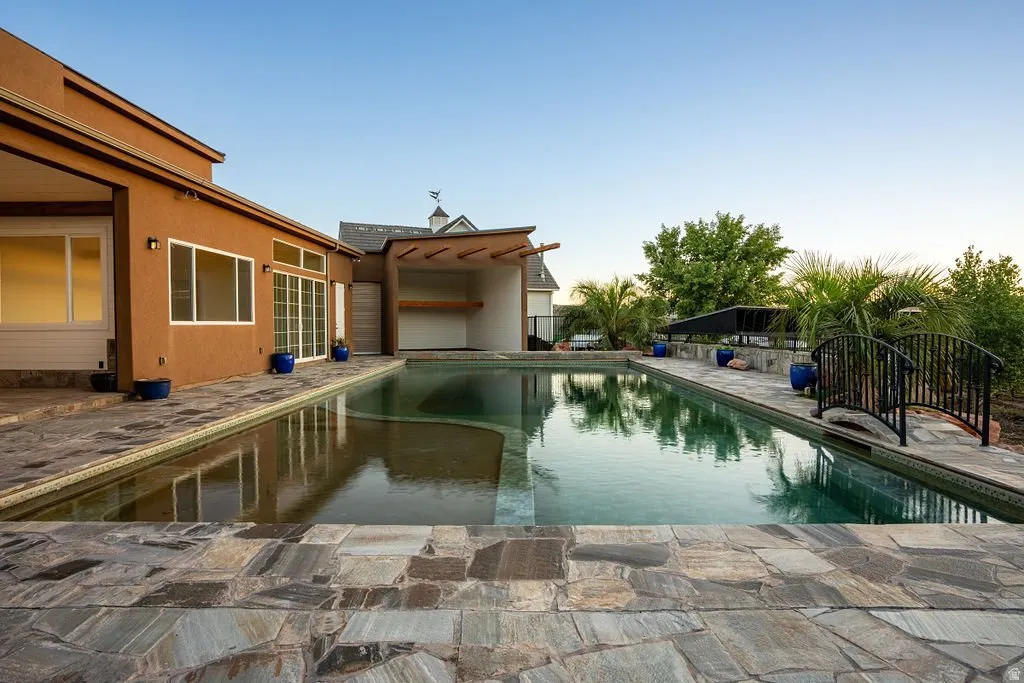 Fourteen feet deep and completely chemical-free — a 50,000-gallon natural pool kept clear by its own planted filtration system.