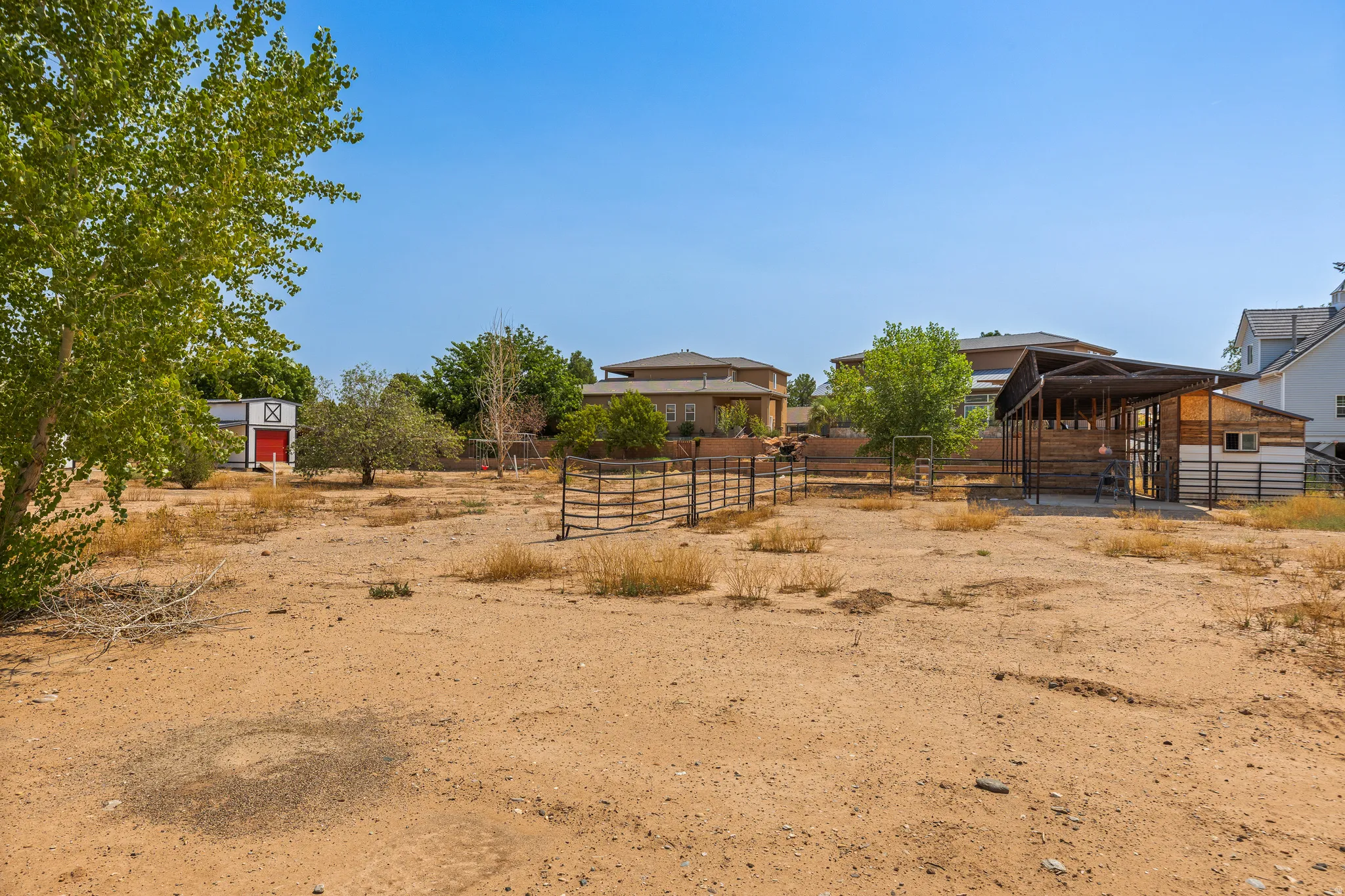 Open, level ground with corrals and outbuildings in place. Everything expensive is already done.