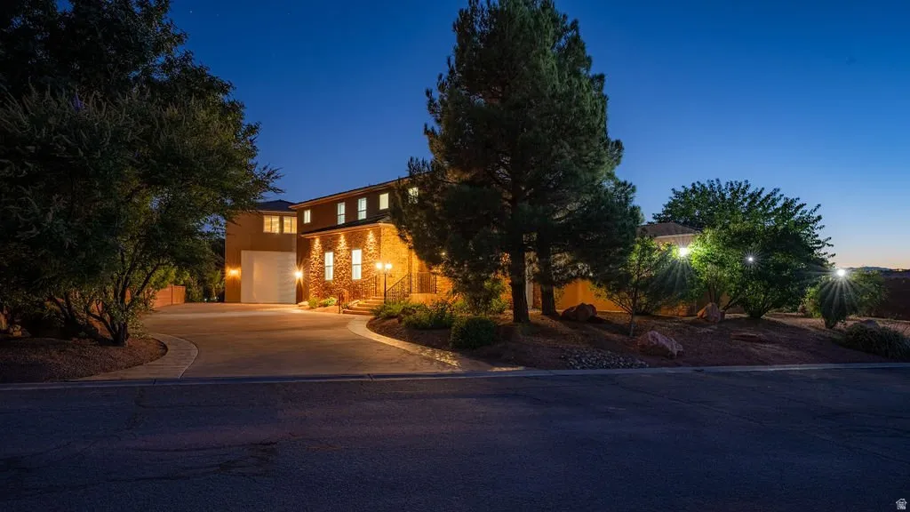 Arrive at the end of a quiet cul-de-sac, down a long private drive, to a home lit against the desert dusk — 3.43 acres of your own at the edge of the Virgin River corridor.