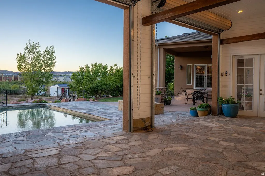 Deep covered patio, flagstone underfoot, looking straight out over the water.