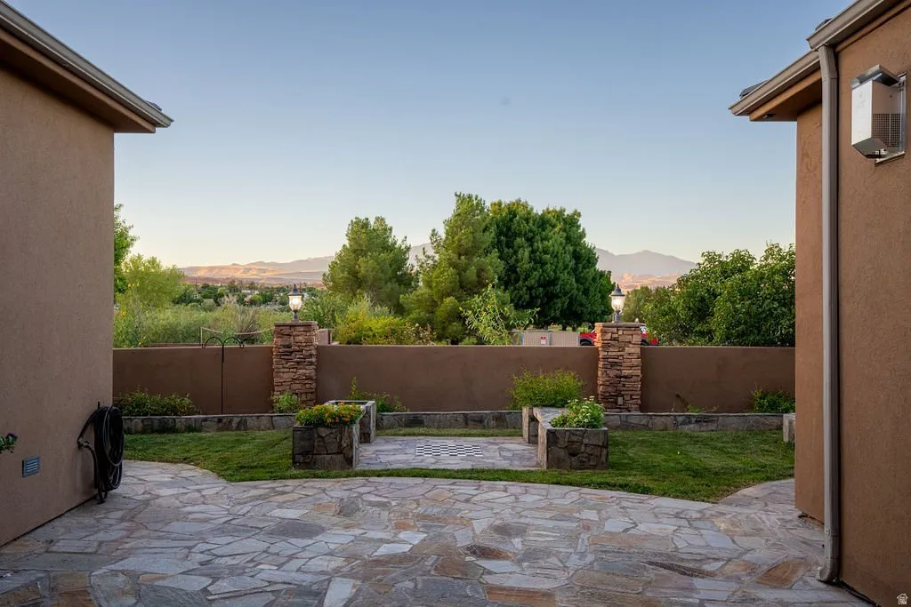 Private courtyard with mountain views beyond the wall.