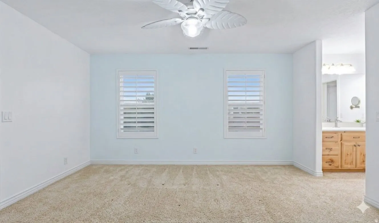 Oversized upstairs bedroom with attached vanity area.