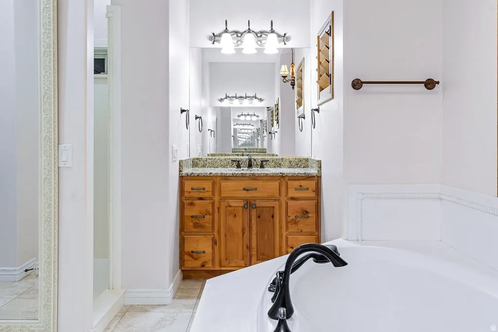 Dual vanity, separate shower, spa-scaled layout.