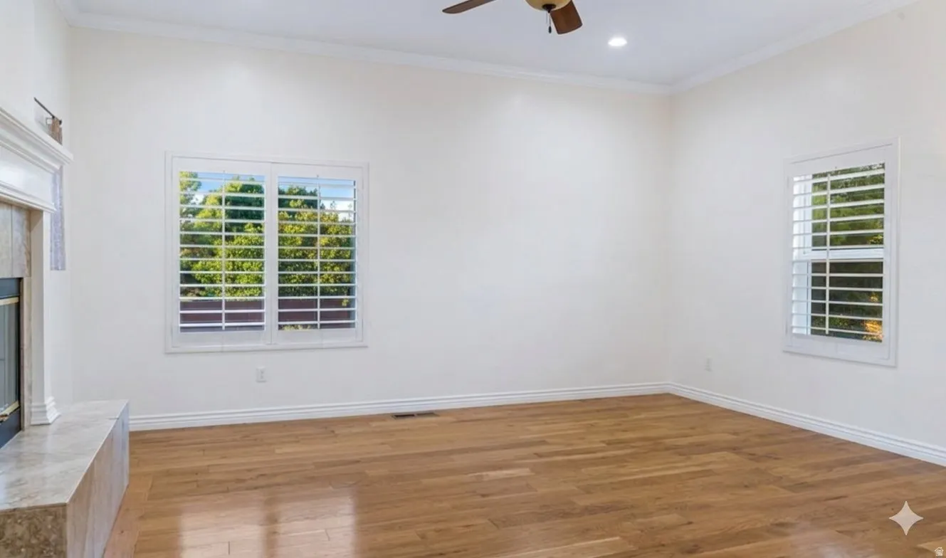 A quieter second sitting room off the entry, with its own fireplace.