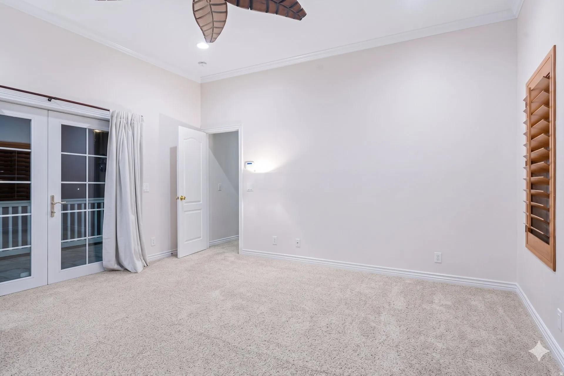 Main-floor primary suite with private door to the yard.