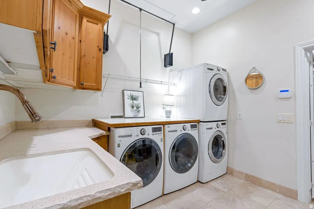 Two full washer-dryer sets, deep sink, folding counter. Laundry built for a nine-bedroom house.