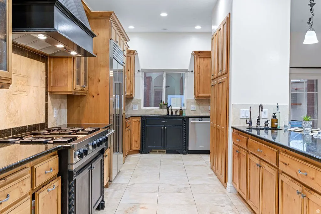 Granite counters and generous prep space, open to the living areas.