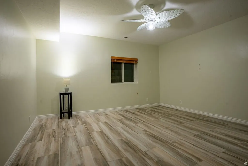 Second lower-level bedroom, wood floors throughout.