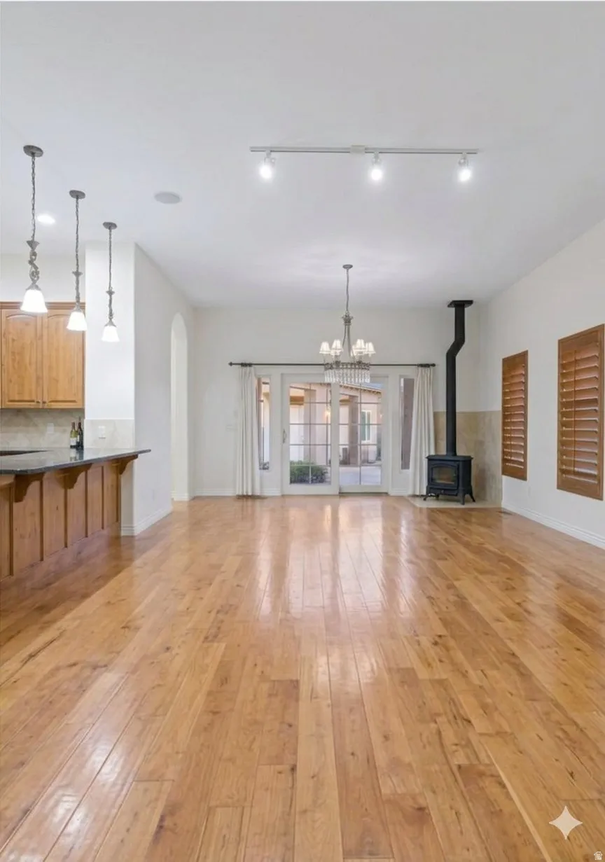 Wide-plank hardwood and clean sightlines from kitchen through living. Built for a full house.