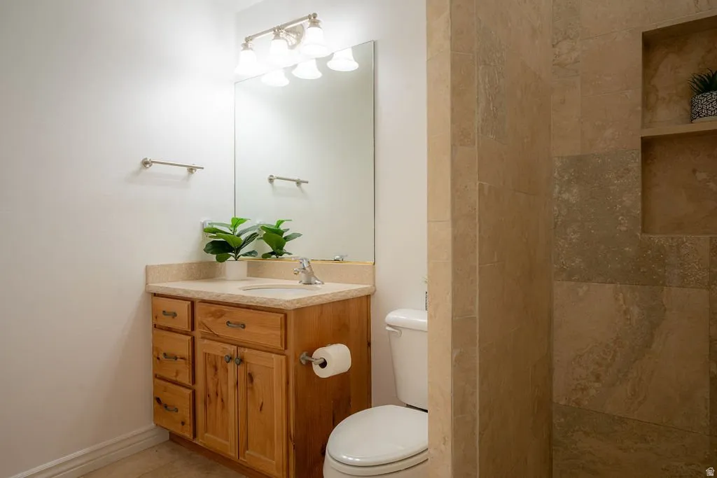 Full bath with oversized walk-in tile shower.