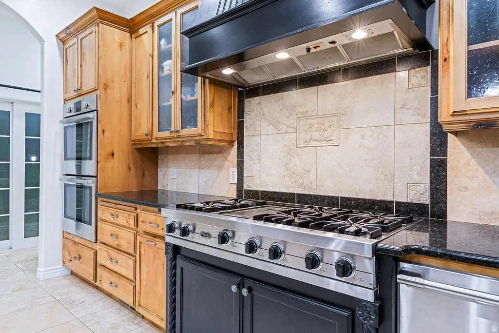 Six burners, double ovens, and a tile-backed range wall built for actual cooking.