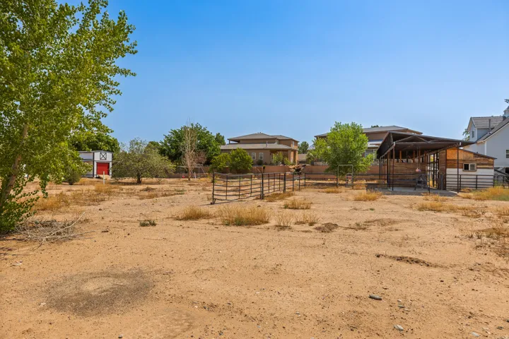Open, level ground with corrals and outbuildings in place. Everything expensive is already done.