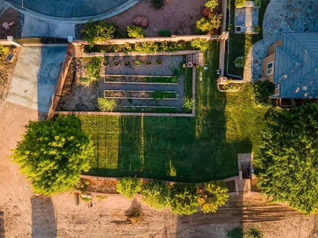 Raised beds and mature fruit trees, established and producing.
