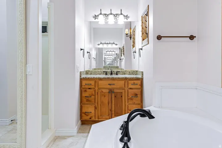 Dual vanity, separate shower, spa-scaled layout.