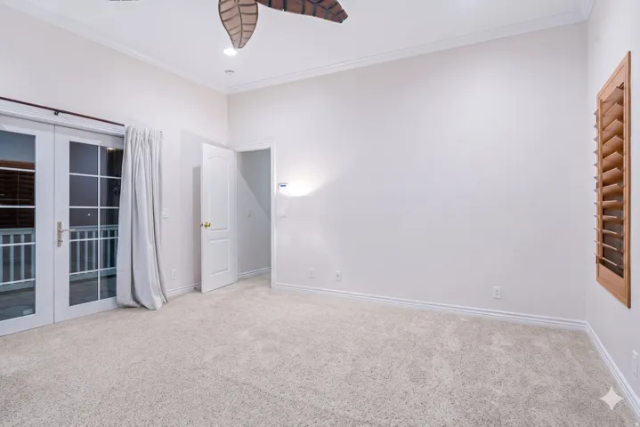 Main-floor primary suite with private door to the yard.