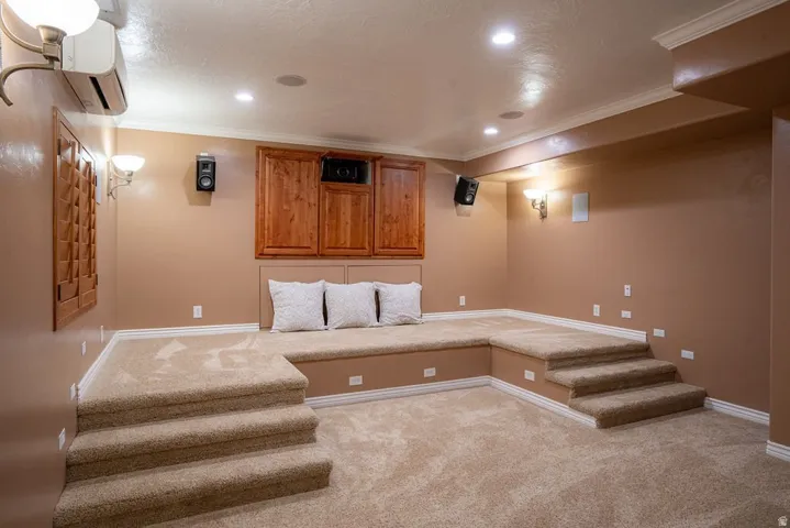 Tiered seating platform, wall-mounted speakers, true 4K screen. A full cinema, not a repurposed spare room.