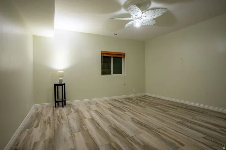 Second lower-level bedroom, wood floors throughout.