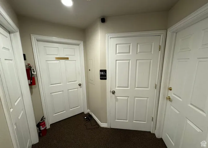 Hall with dark carpet