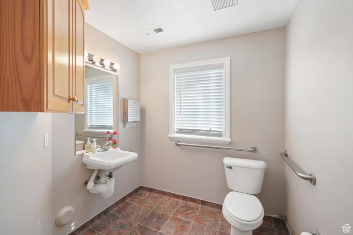 Bathroom featuring sink and toilet