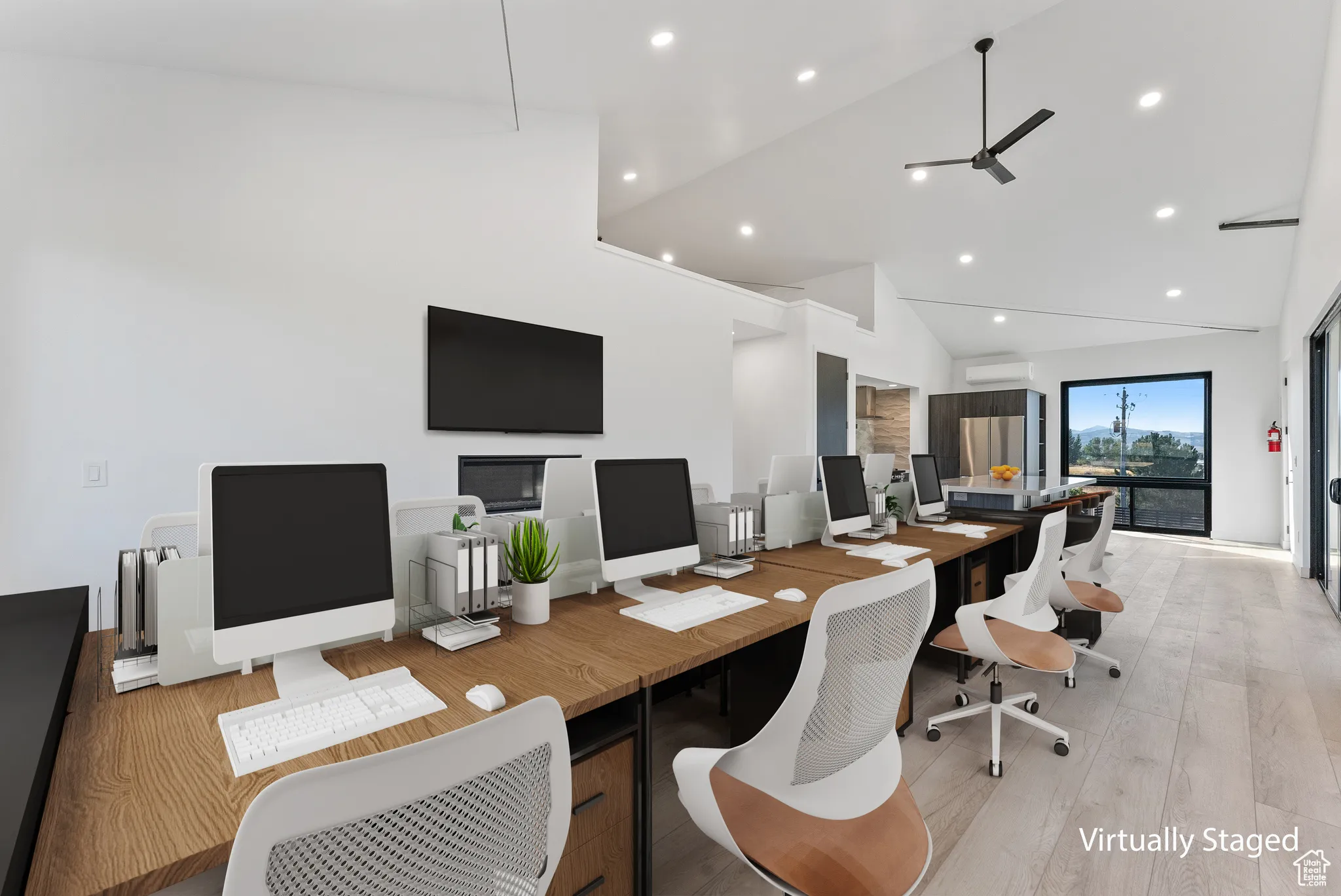 Office space featuring high vaulted ceiling, ceiling fan, light hardwood / wood-style flooring, and a wall mounted AC